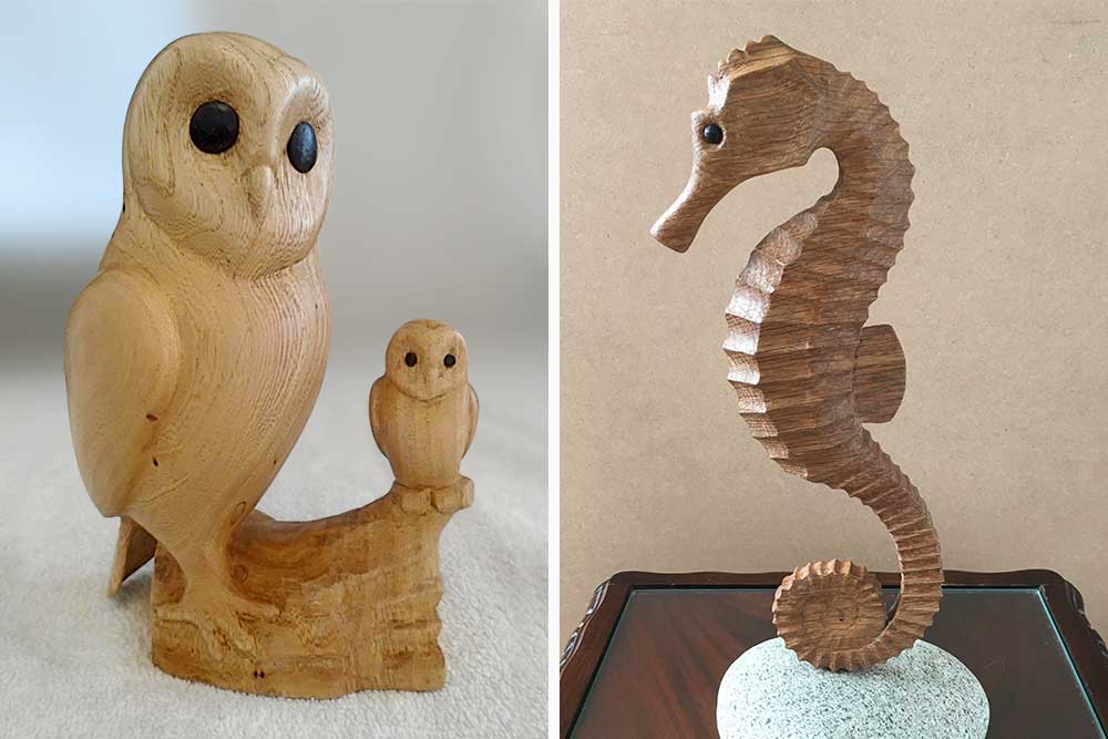 Photo of two woodcarvings, parent and baby owl and a seahorse